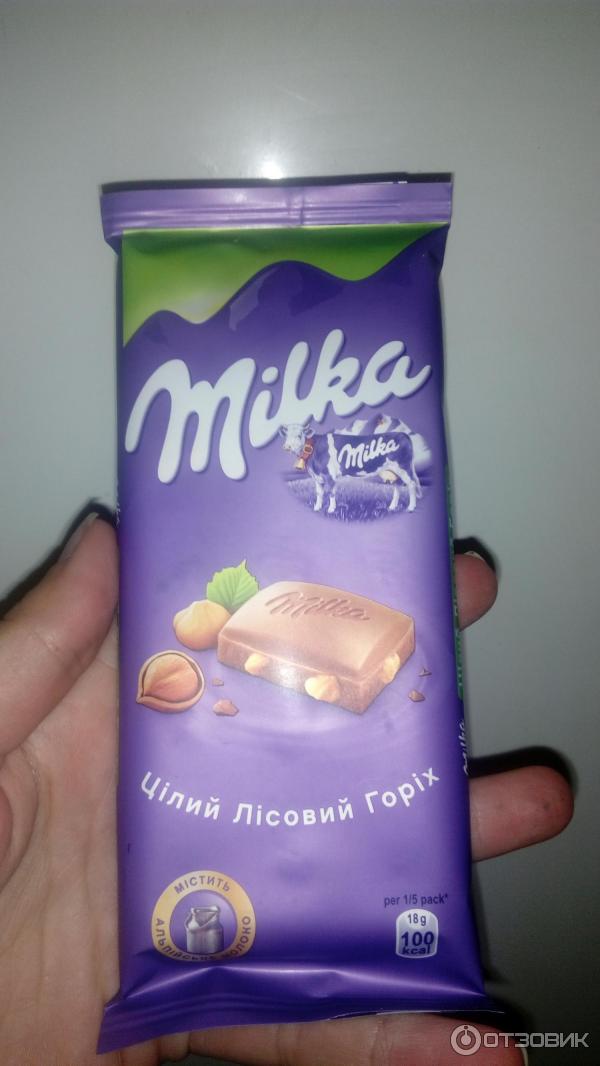 Молочный шоколад Milka с цельным лесным орехом фото