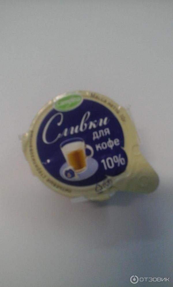 Сливки порционные Campina 10% фото